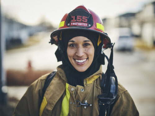 woman firefighter in uniform smiling