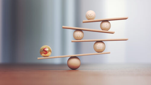 Balls balancing on boards.