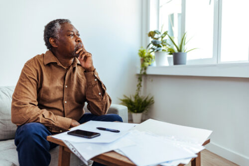Mature businessman looking out of window