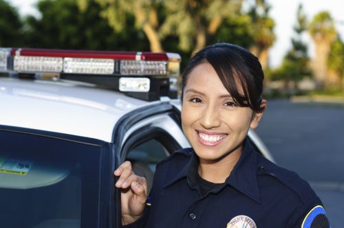 Friendly female Hispanic police officer