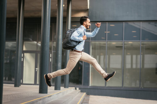 Man running outside of a building