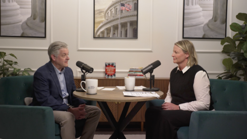 Podcast guests sitting at table.